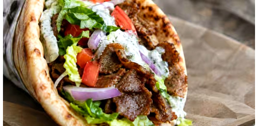 Halal lamb gyro sandwich with white sauce from Empire Halal Deli New Bern NC
